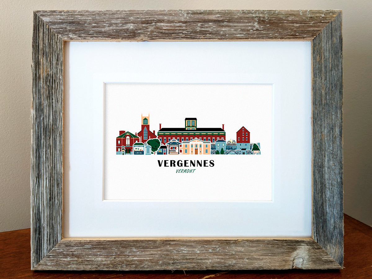 Framed art print of buildings arranged in a skyline with the text Vergennes Vermont