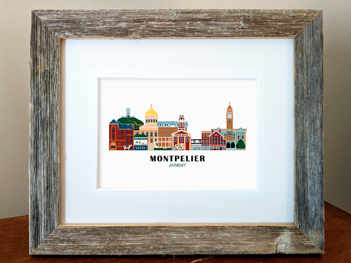 Framed art print of buildings arranged in a skyline with the text Montpelier Vermont